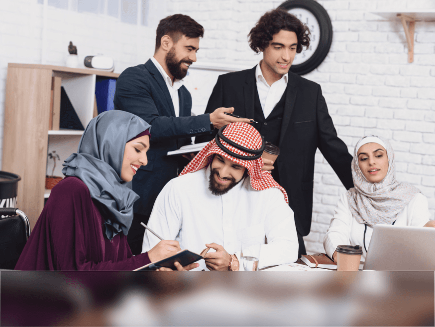 Team collaborating around a desk in a bright office